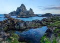 tide pool and camel rock at bermagui during a spring afternoon Royalty Free Stock Photo