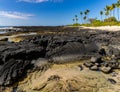 Tide Pool On The Volcanic Shoreline of Keiki Beach Royalty Free Stock Photo