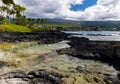 Tide Pool On The Volcanic Shoreline of Keiki Beach Royalty Free Stock Photo