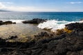 Tide Pool On The Volcanic Shoreline of Keiki Beach Royalty Free Stock Photo