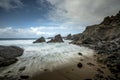 Tide rushes over rocks near the Bedruthian Steps, Cornwall Royalty Free Stock Photo