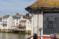 Tide times displayed on a blackboard on the Whitby Swing Bridge, Whitby, North Yorkshire, UK Royalty Free Stock Photo