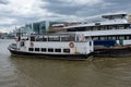 Tideway boat docked in the river themes. Royalty Free Stock Photo