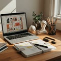 A tidy desk features an open laptop displaying a design program, a planner with Royalty Free Stock Photo