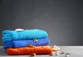 Tidy towels and seashells on grey table Royalty Free Stock Photo