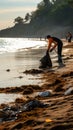 Tidying up the beach: Volunteers use rakes to collect trash.