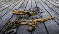 Tie down chains and binders on wood boards of flatbed trailer