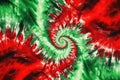 Tie Dye red green christmas spiral background.