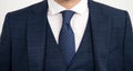 Tie goes inside vest. Vested three-piece suit worn with tie. Necktie collection. Fashion accessory. Formal style Royalty Free Stock Photo