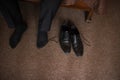 The man wears shoes. Tie the laces on the shoes. Men`s style. Professions. To prepare for work, to the meeting. Royalty Free Stock Photo