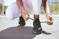 Tie shoes, marathon running and woman start training workout, exercise and sports fitness in outdoor urban city. Closeup Royalty Free Stock Photo