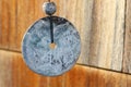 Closeup Detail of the Round Pendulum of a Wind Chime