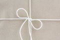 Tied in a bow on a brown recycled paper Royalty Free Stock Photo