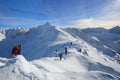 Tied climbers climbing mountain with snow field tied