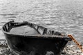 Fishing boat full of water on the shore Royalty Free Stock Photo