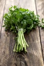 Tied fresh parsley on wooden surface