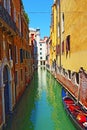 Tied gondola narrow canal aged houses Venice Italy