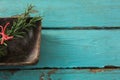 Tied rosemary in wooden bowl