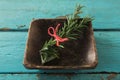 Tied rosemary in wooden bowl