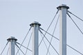 Tied Suspension Roof Cables, Three Tall Grey Masts, Cable-suspended Swooping Rooftop Pylon Anchors, Pale Blue Summer Sky, Large