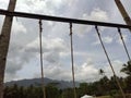 Tied swing rope with blue sky background