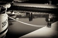 Tied up ship at Tromso pier in sepia background