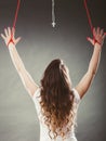 Tied woman forced to worship. Fake faith religion. Royalty Free Stock Photo