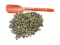 Tieguanyin chinese oolong tea and wooden scoop isolated on a white background