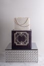 2 tier black and white wedding cake decorated with geometric pat