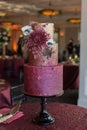 3 Tier Gold and Maroon Textured Wedding Cake With Edible Dahlia