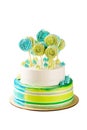 Tiered green and blue birthday cake isolated on white Royalty Free Stock Photo