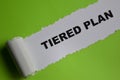 The tiered plan Text written in torn paper Royalty Free Stock Photo