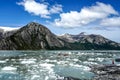 Zodiac boats from Ventus Australis expedition ship transfer tourists on the shore near Pia glacier in Patagonia