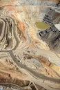 An aerial view inside an open pit copper mine.