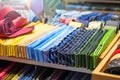 Ties of shade and colorful tones with strict design pattern are folded in row in the window of fashionable mens clothing store