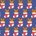 Tiger in christmas gift sock seamless pattern. Cool baby repeatable print. Vector illustration on blue background. Royalty Free Stock Photo