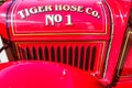 Tiger hose No 1 red and white fire truck details Royalty Free Stock Photo