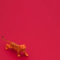 Tiger on a red background wallpaper with copy space. Minimai scene Royalty Free Stock Photo