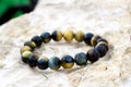 Tiger`s eye also called tiger eye is a chatoyant gemstone that is usually a metamorphic rock with a golden to red-brown colour Royalty Free Stock Photo