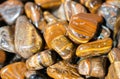 Tiger`s eye and hawk`s eye gemstone as mineral rock