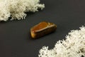 Tiger's eye stone from Republic of South Africa RSA. Natural mineral stone on black background. Mineralogy, geology Royalty Free Stock Photo