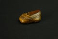 Tiger's eye stone from Republic of South Africa RSA. Natural mineral stone on black background. Mineralogy, geology