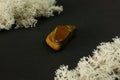 Tiger's eye stone from Republic of South Africa RSA. Natural mineral stone on black background. Mineralogy, geology Royalty Free Stock Photo