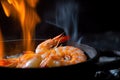 tiger shrimp prawn sizzling in a pan, with its shell on fire