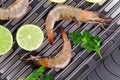 Tiger shrimps on black pan. Royalty Free Stock Photo