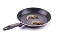 Tiger shrimps on black pan. Royalty Free Stock Photo