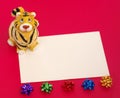 Tiger statuette and blank on red