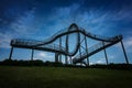 Tiger and Turtle, a walkable roller coaster sculpture on Magic Mountain against a dark cloudy sky at the blue hour, art Royalty Free Stock Photo