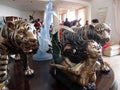 Tigers, Dolphins, and a Mermaid Sculputres display on a table at