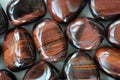 Ox Eye, Dragonâs Eye, Cats Eye, Red Tigers Eye Tumbled Stones Royalty Free Stock Photo